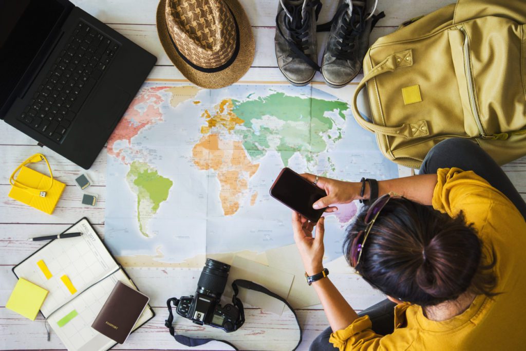 Young man preparing and planning for her holiday trip